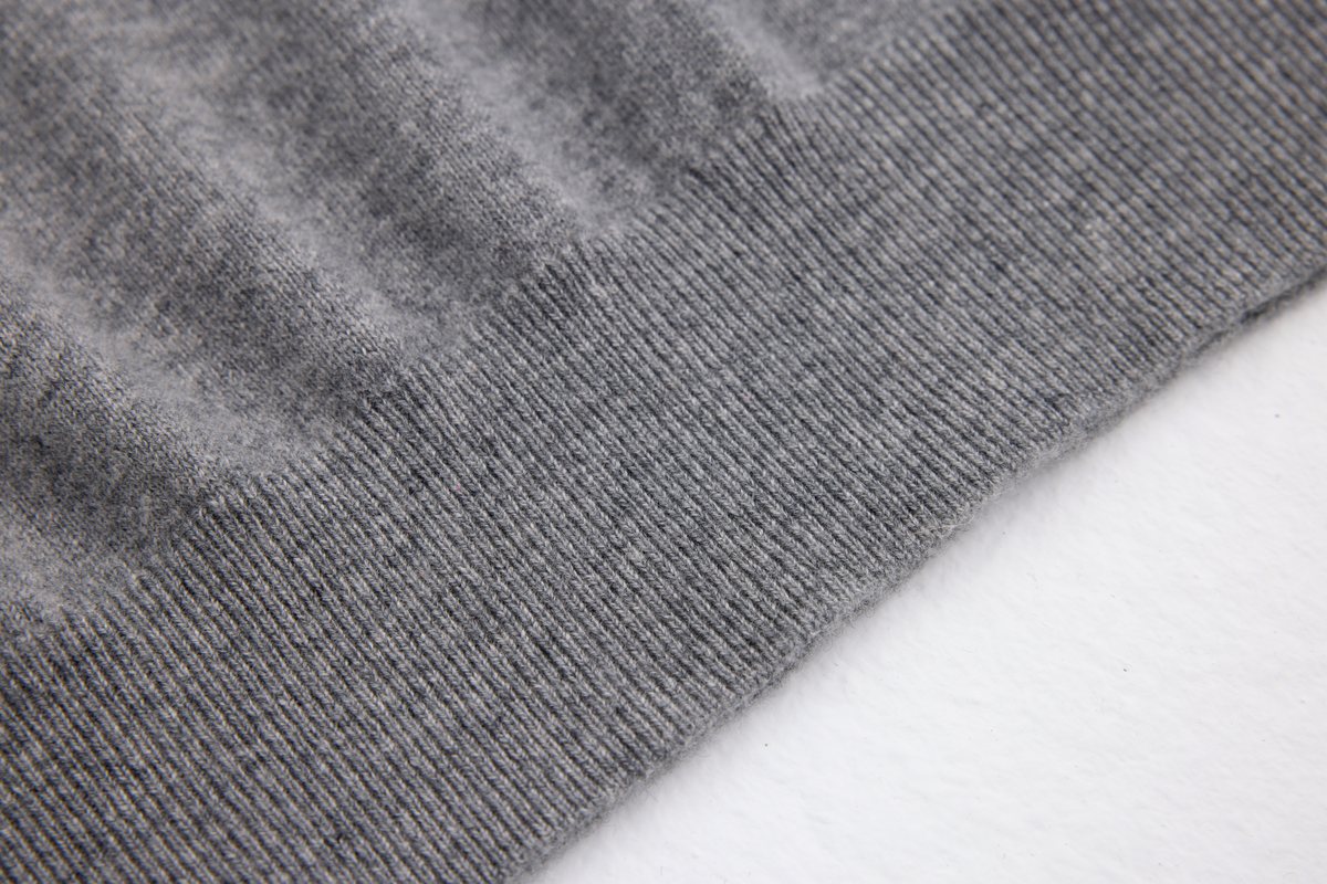 Close-up of long cashmere fibers and refined knit surface
